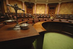 Symbol of law and justice in the empty courtroom, law and justice concept.